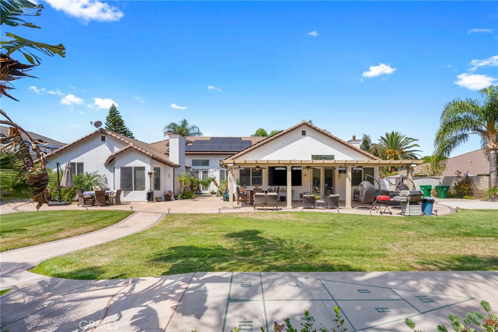 2885 Citrocado Ranch Street Corona, CA 92881 - Photo 33 of 51 a front view of a house with a yard