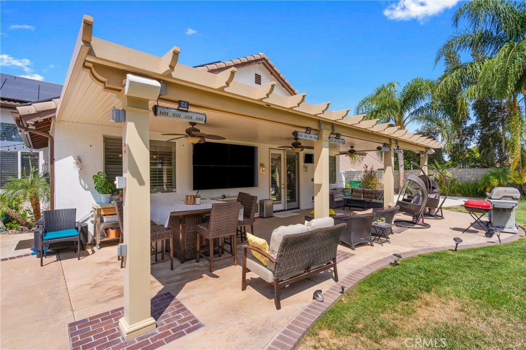 2885 Citrocado Ranch Street Corona, CA 92881 - Photo 34 of 51 a view of a patio with couches and a fire pit and a fire pit