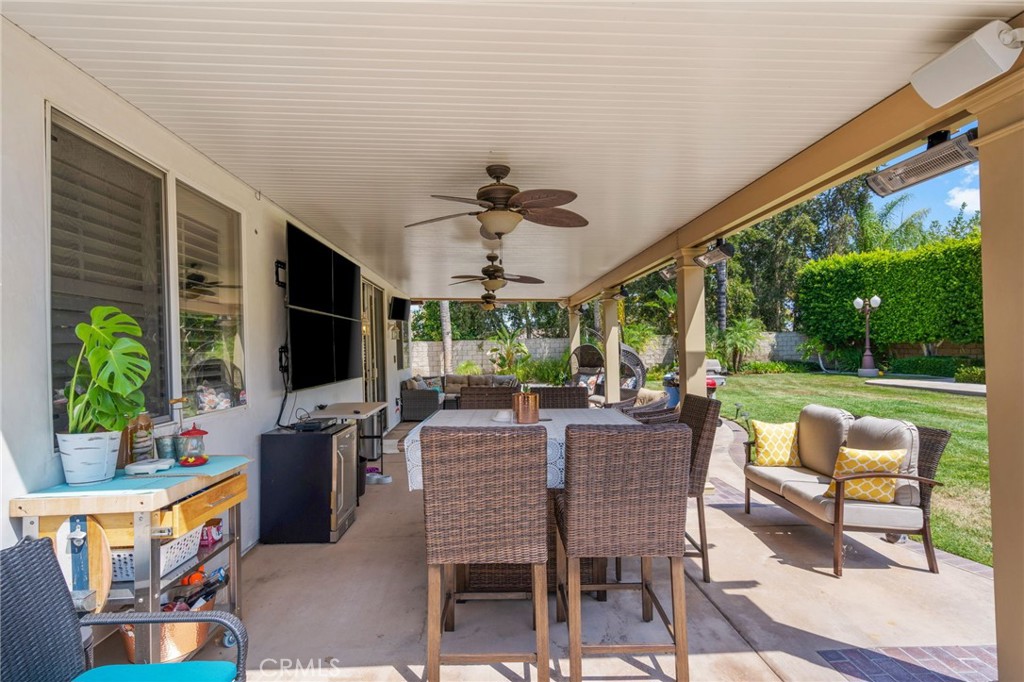 2885 Citrocado Ranch Street Corona, CA 92881 - Photo 35 of 51 a view of a patio with a dining table and chairs