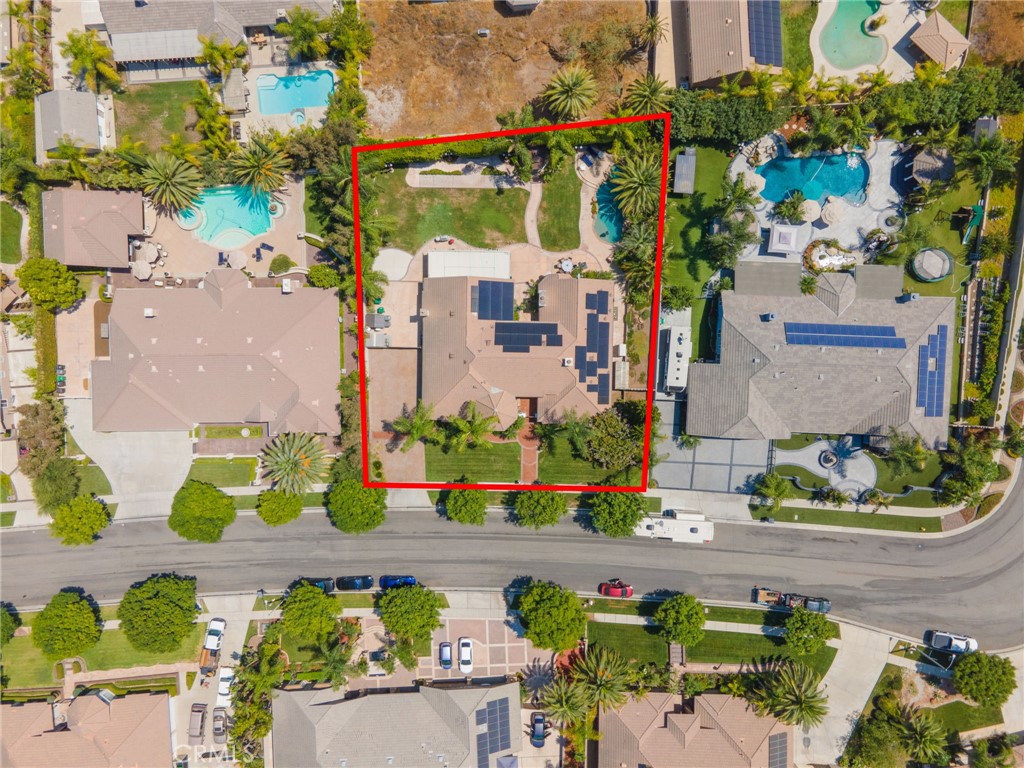 2885 Citrocado Ranch Street Corona, CA 92881 - Photo 40 of 51 an aerial view of a house with a yard and garden