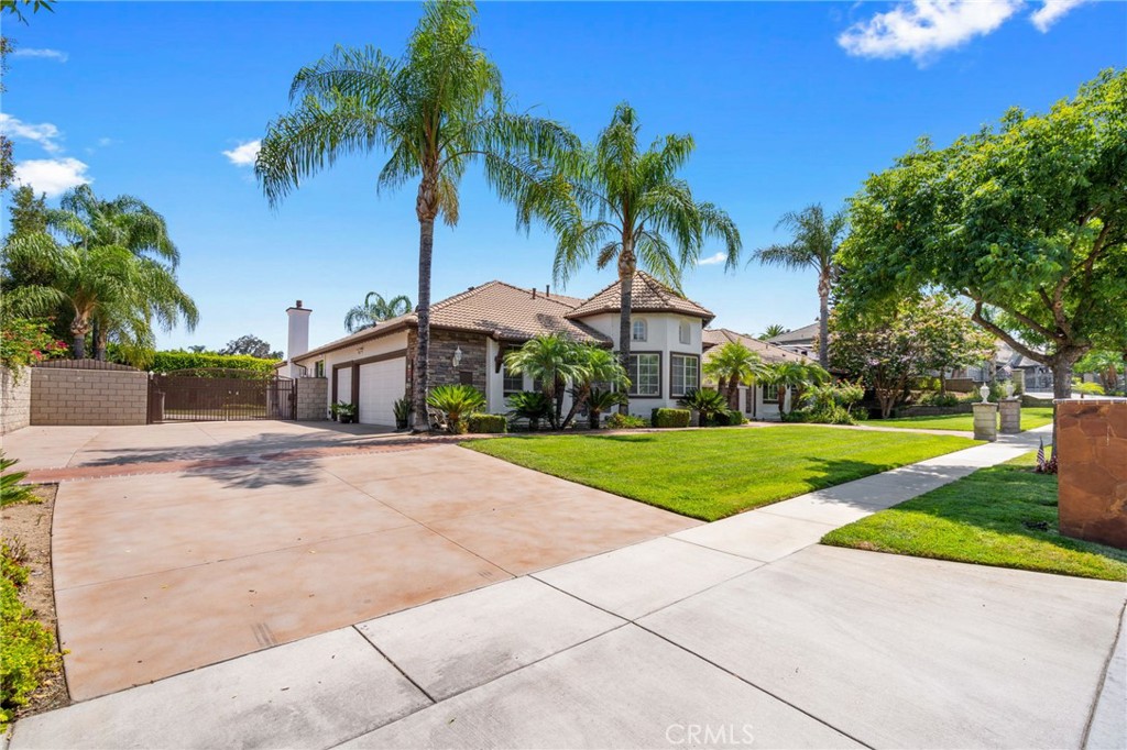 2885 Citrocado Ranch Street Corona, CA 92881 - Photo 4 of 51 a front view of house with yard and green space