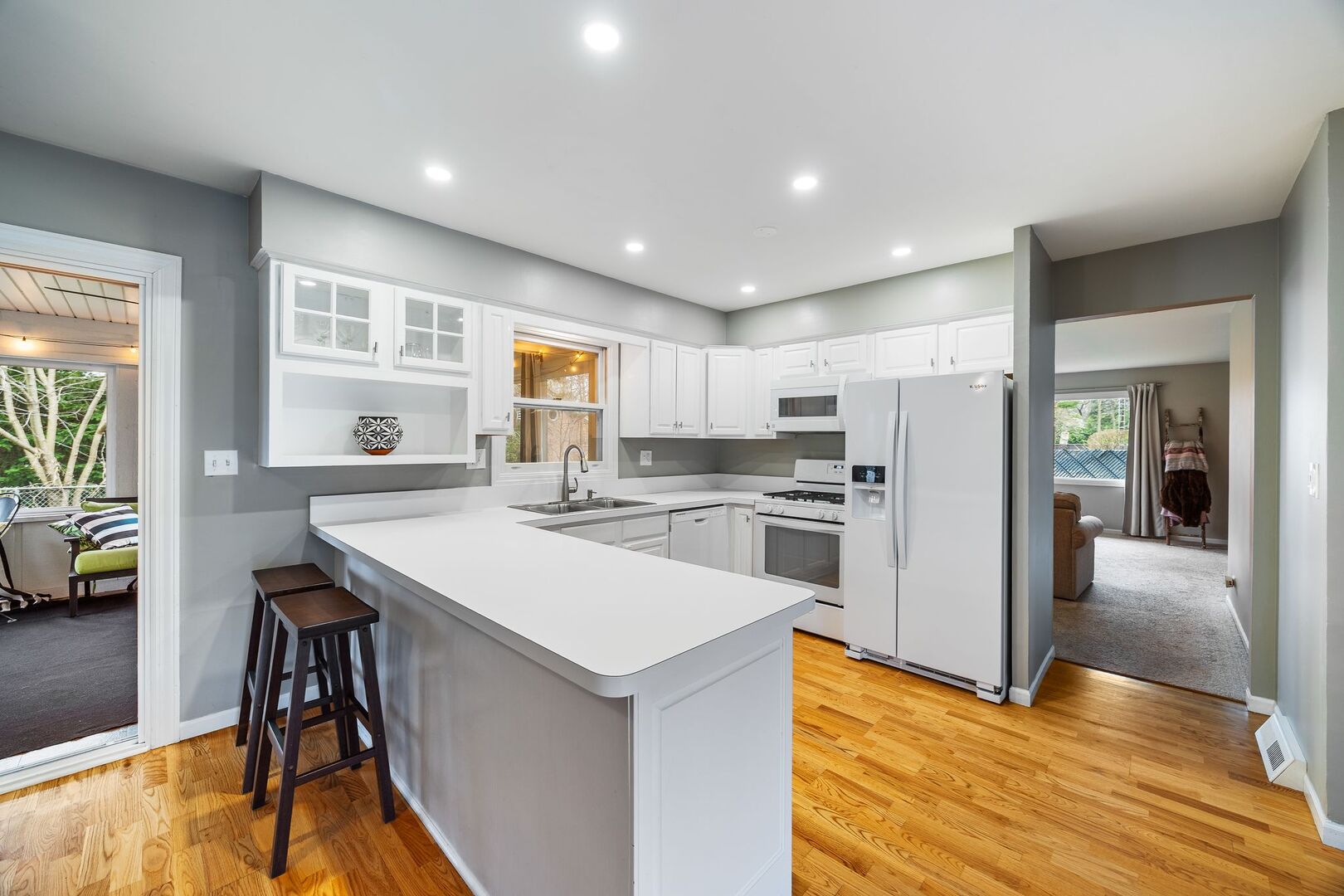 425 North Alfred Avenue Elgin, IL 60123 - Photo 8 of 33 a kitchen with refrigerator cabinets and wooden floor