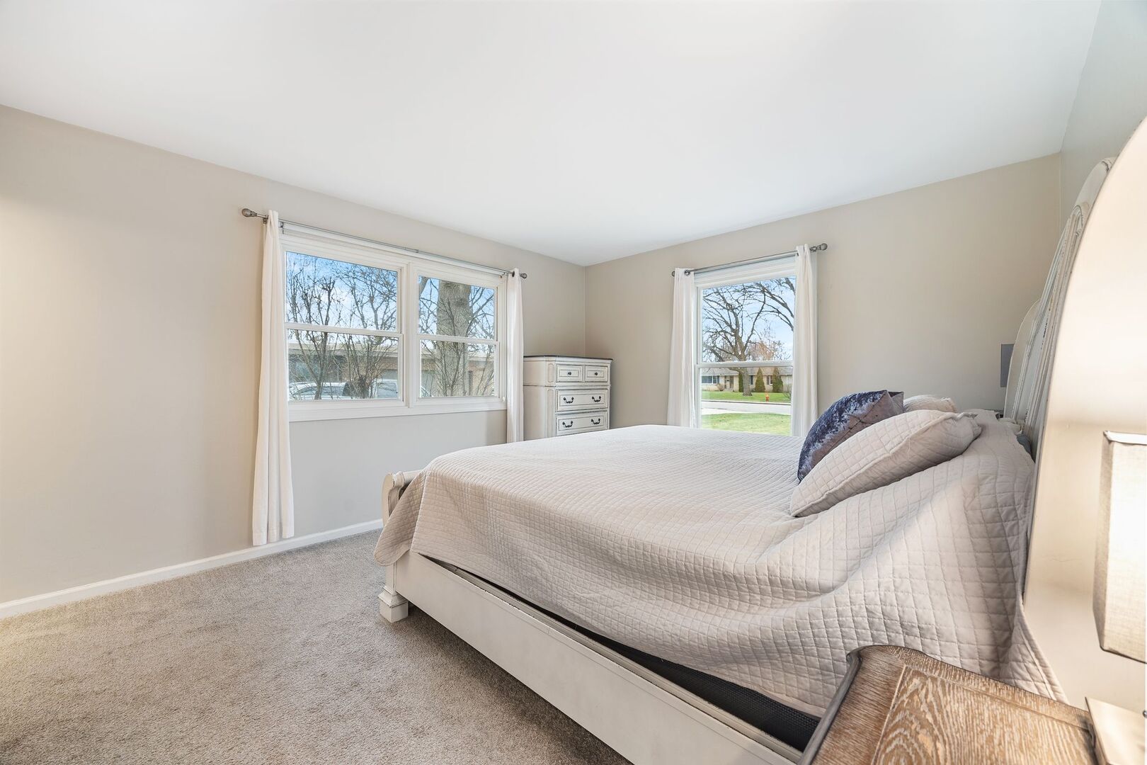 425 North Alfred Avenue Elgin, IL 60123 - Photo 10 of 33 a bed sitting in a bedroom next to a window