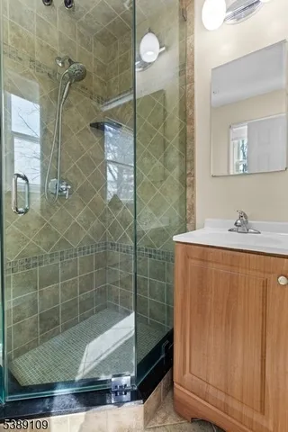 a bathroom with a shower and a sink