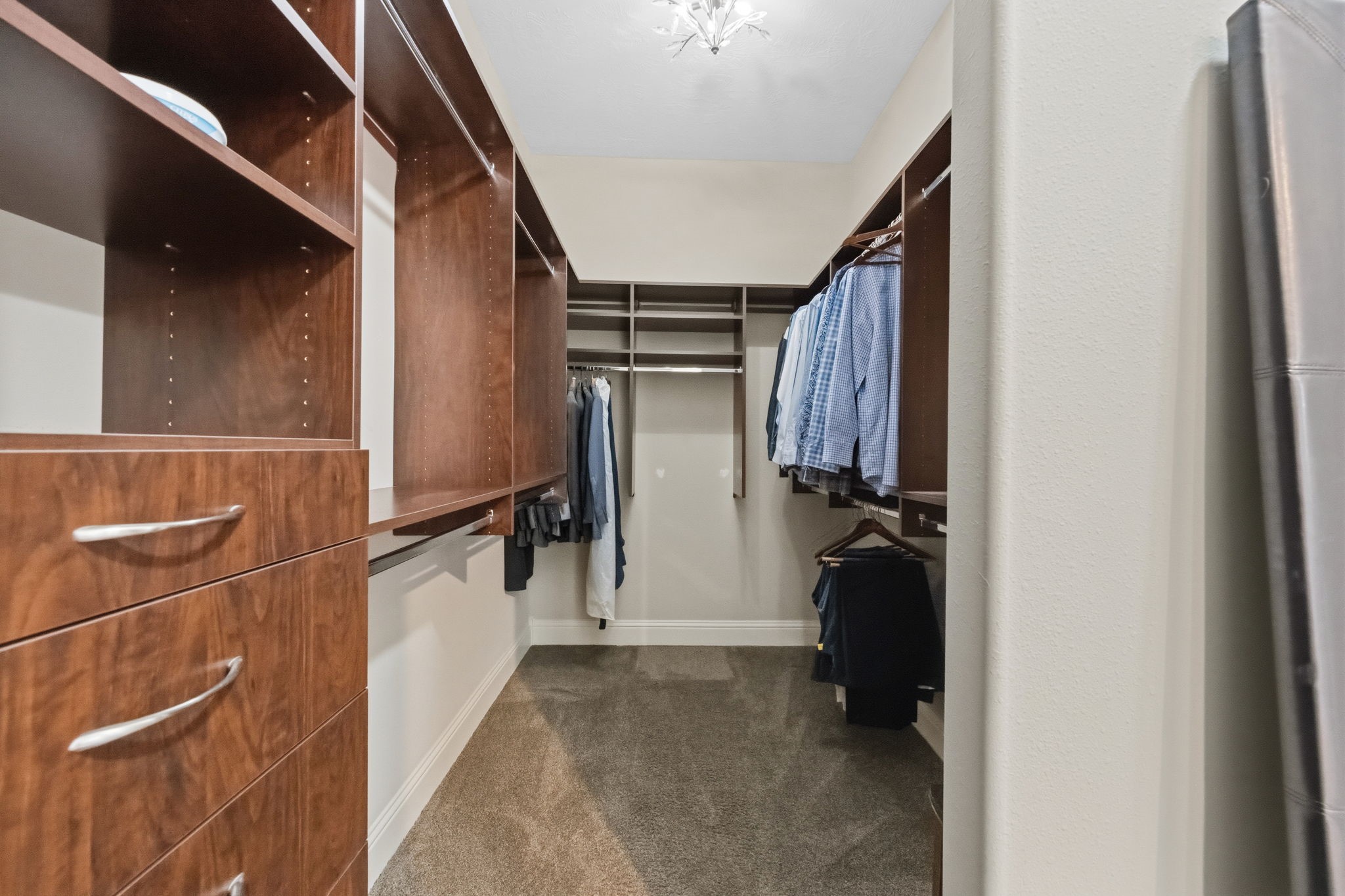 19908 Cullen Ridge Drive Porter, TX 77365 - Photo 24 of 42 So much space in the primary closet for organizing.
