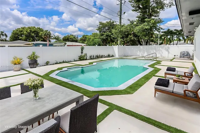 a view of a swimming pool with a patio