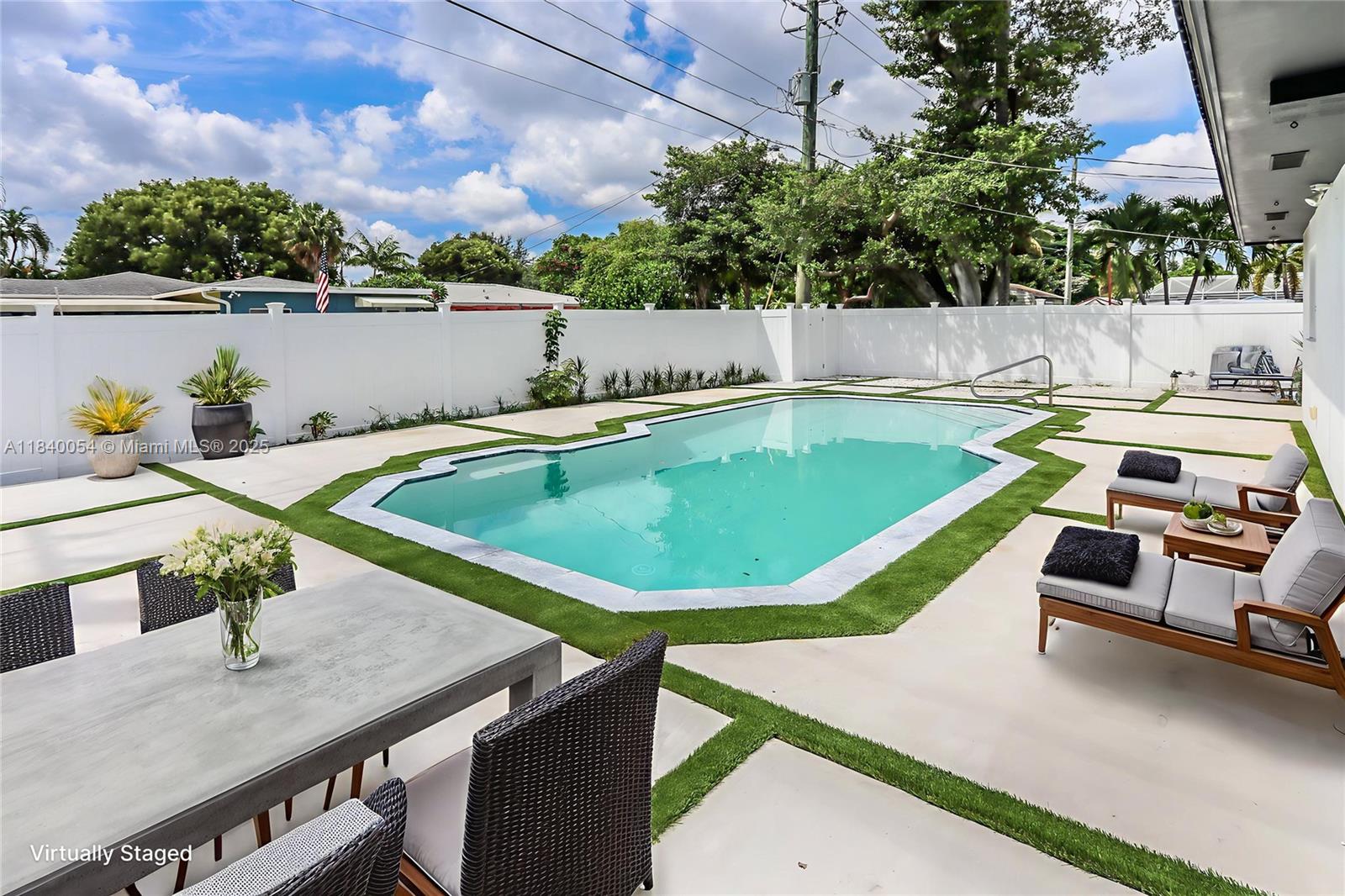 a view of a swimming pool with a patio