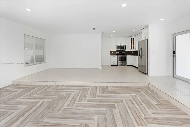 a view of a kitchen with furniture and window