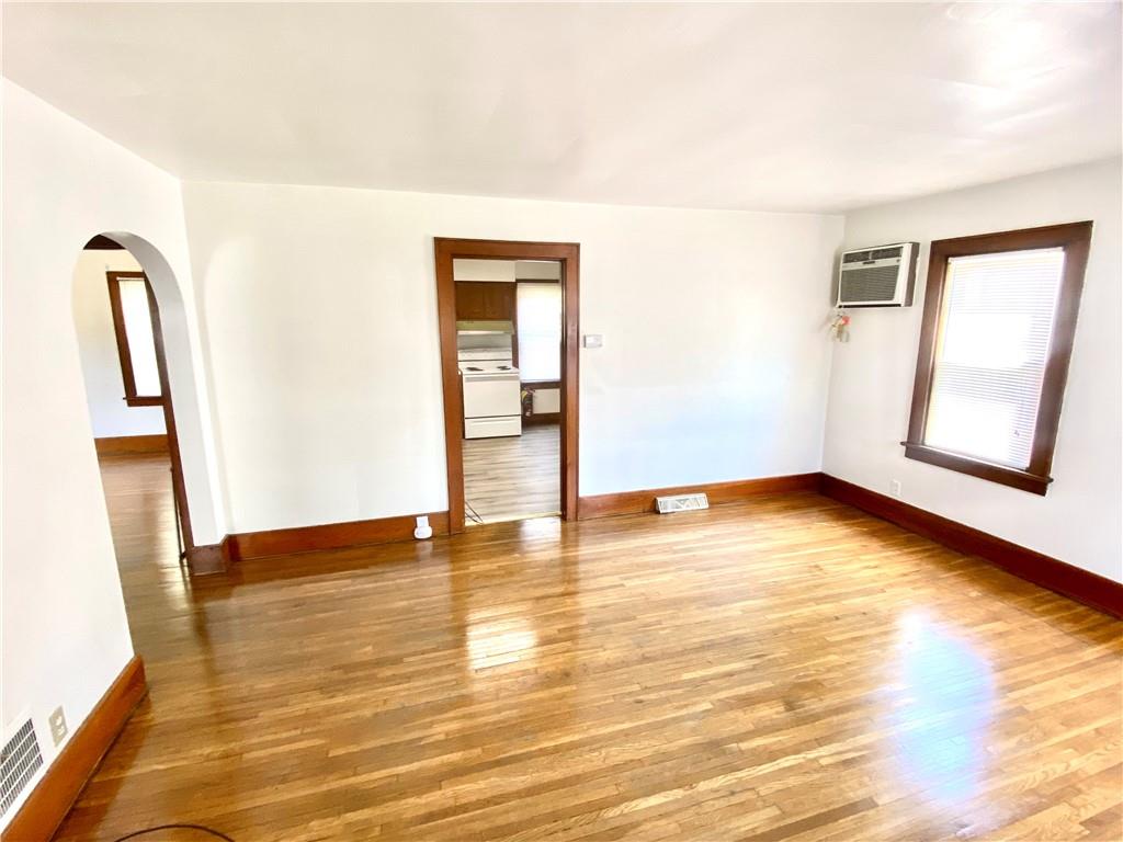 671 Washington Street Indiana, PA 15701 - Photo 3 of 20 a view of an empty room with wooden floor and a window