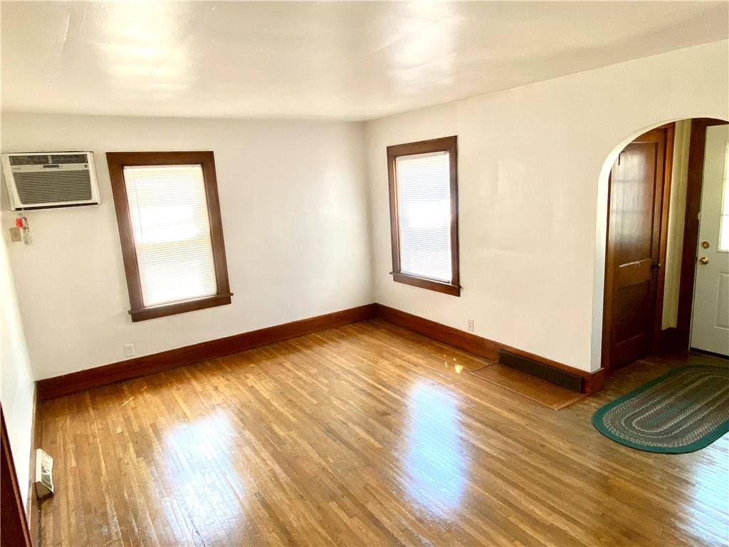671 Washington Street Indiana, PA 15701 - Photo 4 of 20 a view of an empty room with wooden floor and a window