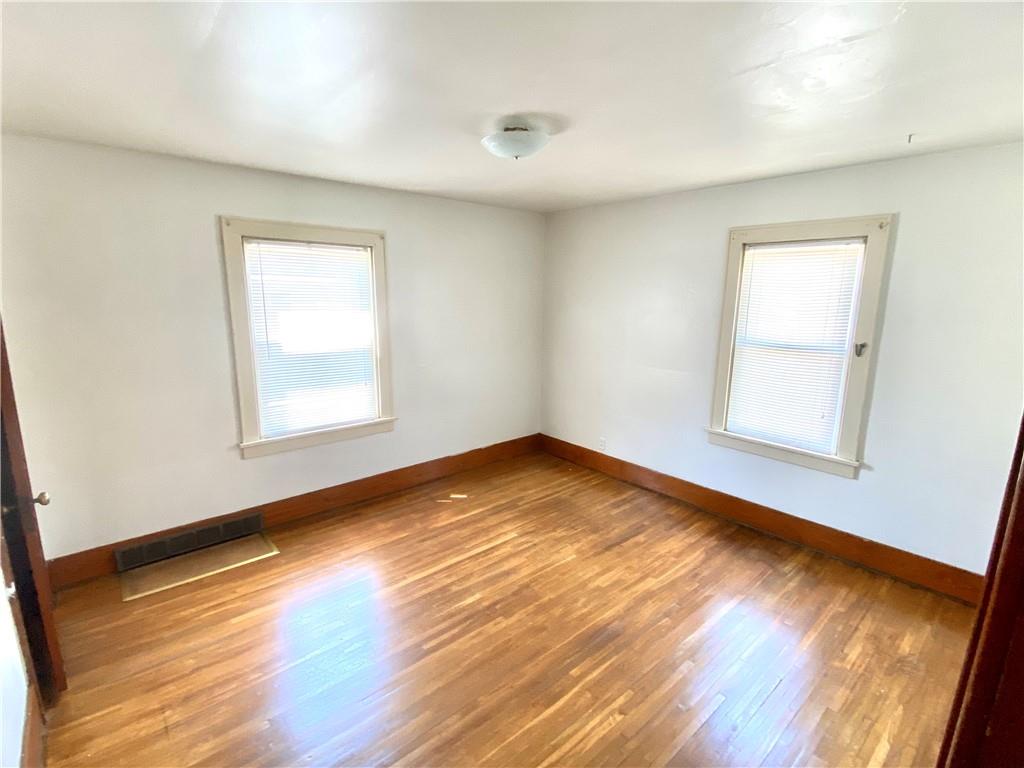 671 Washington Street Indiana, PA 15701 - Photo 7 of 20 a view of empty room with wooden floor and fan