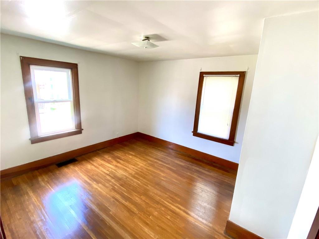 671 Washington Street Indiana, PA 15701 - Photo 9 of 20 an empty room with wooden floor and windows
