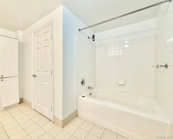 a room with gym equipment and a flat screen tv