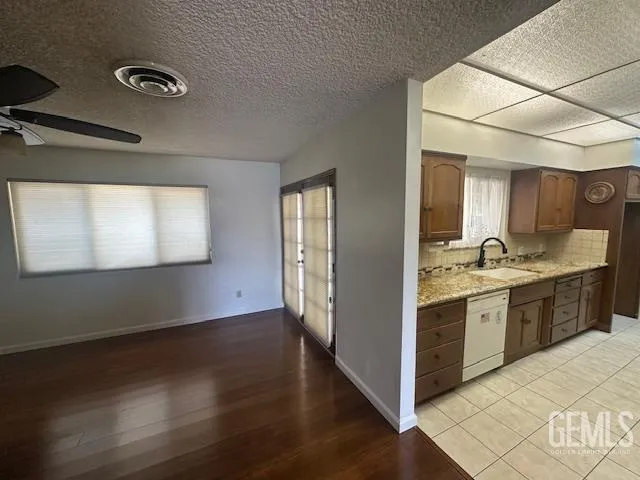 a view of a kitchen wooden floor and a sink
