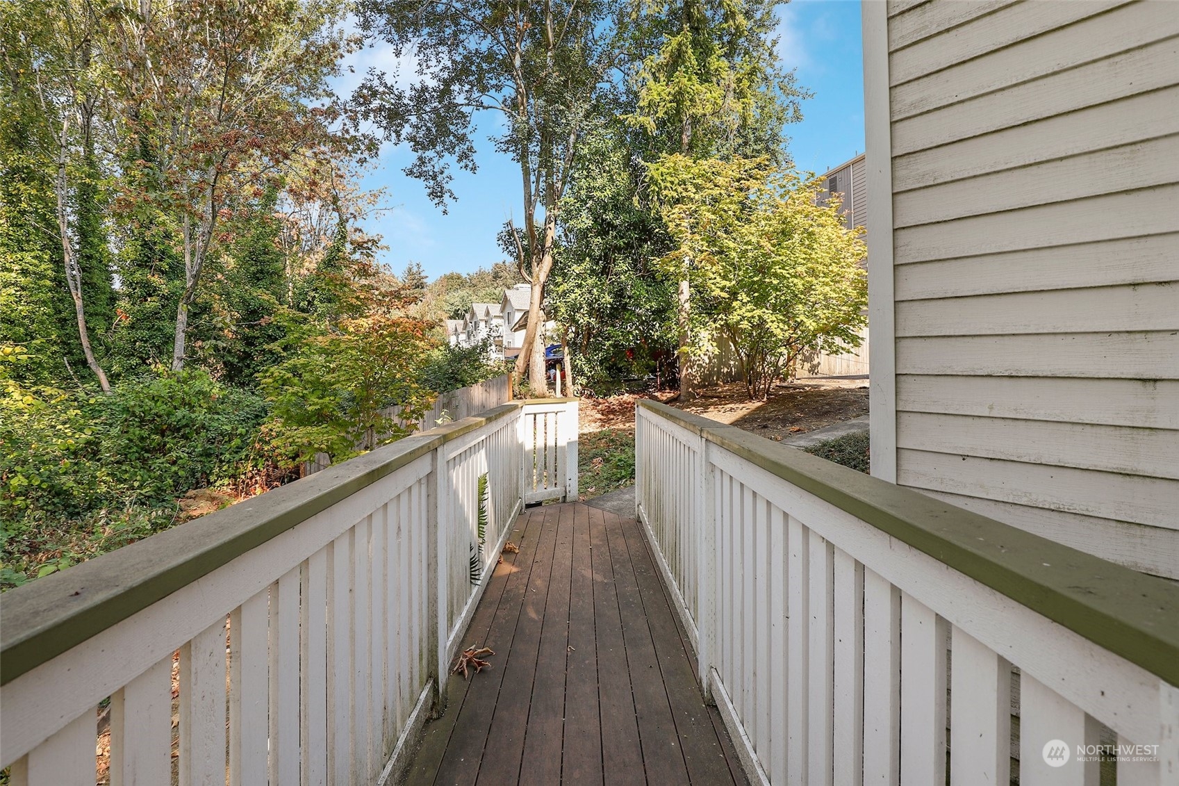 901 Sunset Boulevard Northeast, Unit D115 Renton, WA 98056 - Photo 17 of 19 a view of a balcony with wooden fence and floor