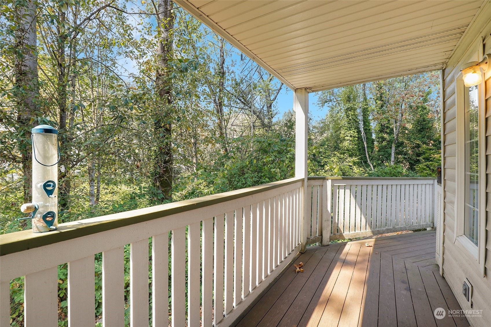 901 Sunset Boulevard Northeast, Unit D115 Renton, WA 98056 - Photo 8 of 19 a view of a wooden deck and a yard