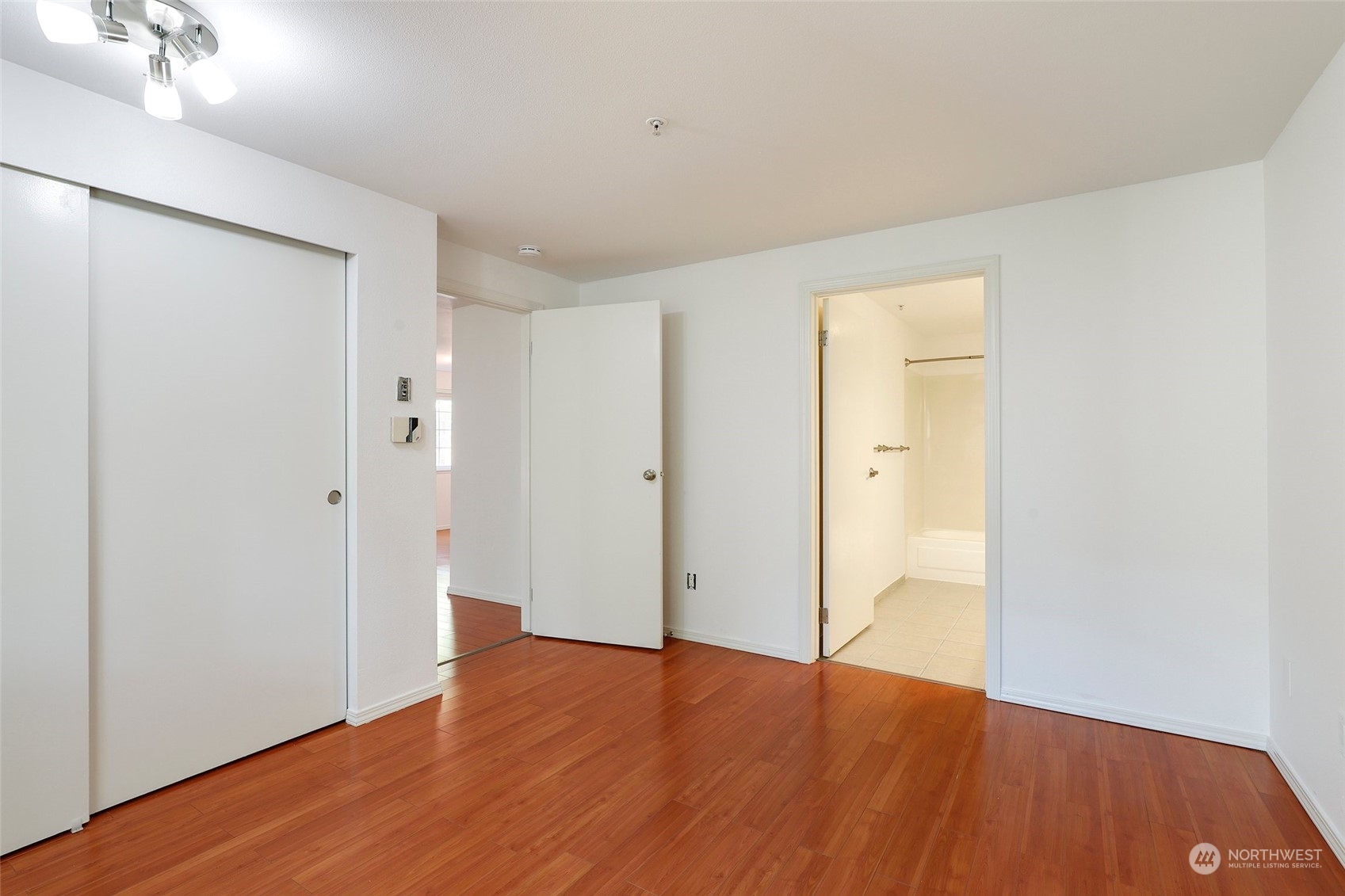 901 Sunset Boulevard Northeast, Unit D115 Renton, WA 98056 - Photo 10 of 19 wooden floor in an empty room