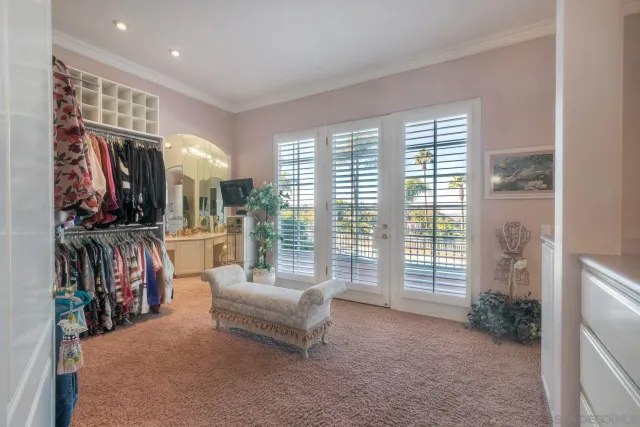 a view of a livingroom with furniture and a window