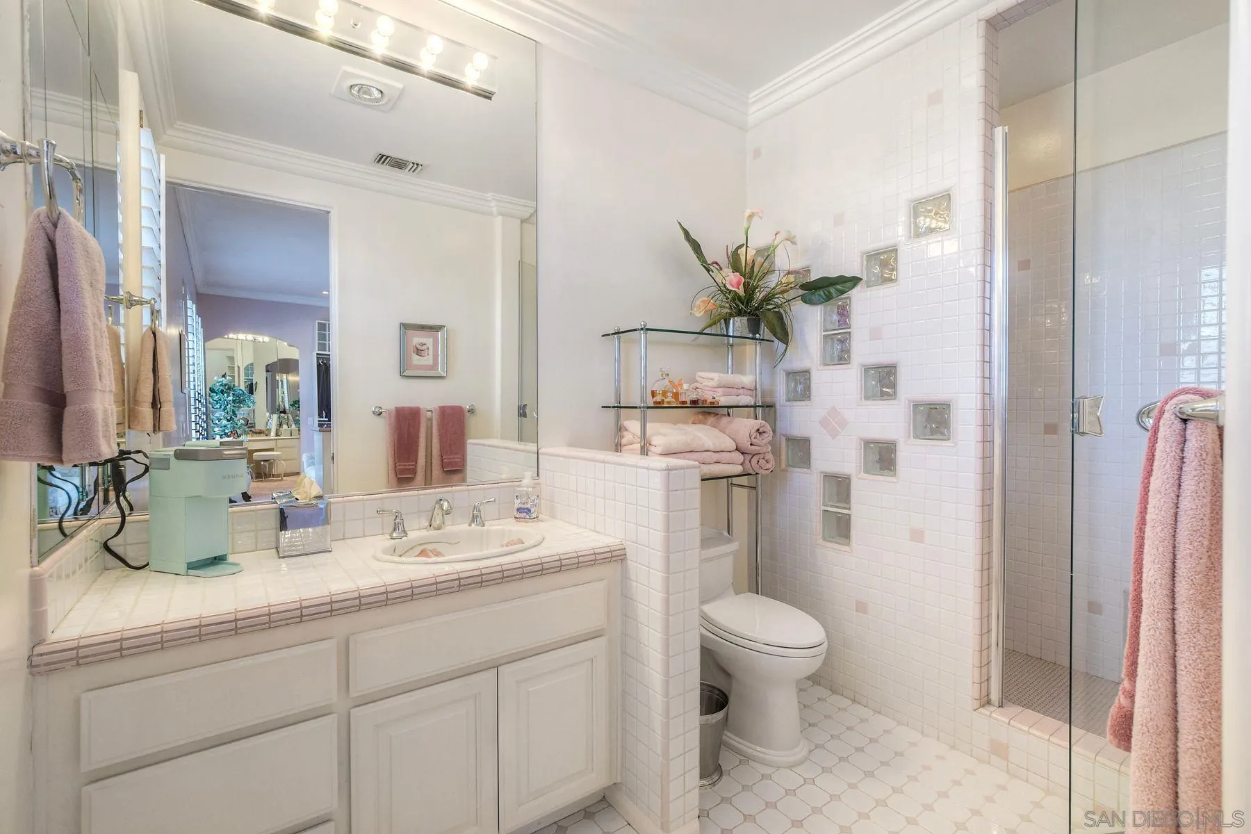 13455 Old Winery Road Poway, CA 92064 - Photo 18 of 46 a bathroom with a double vanity sink toilet and shower