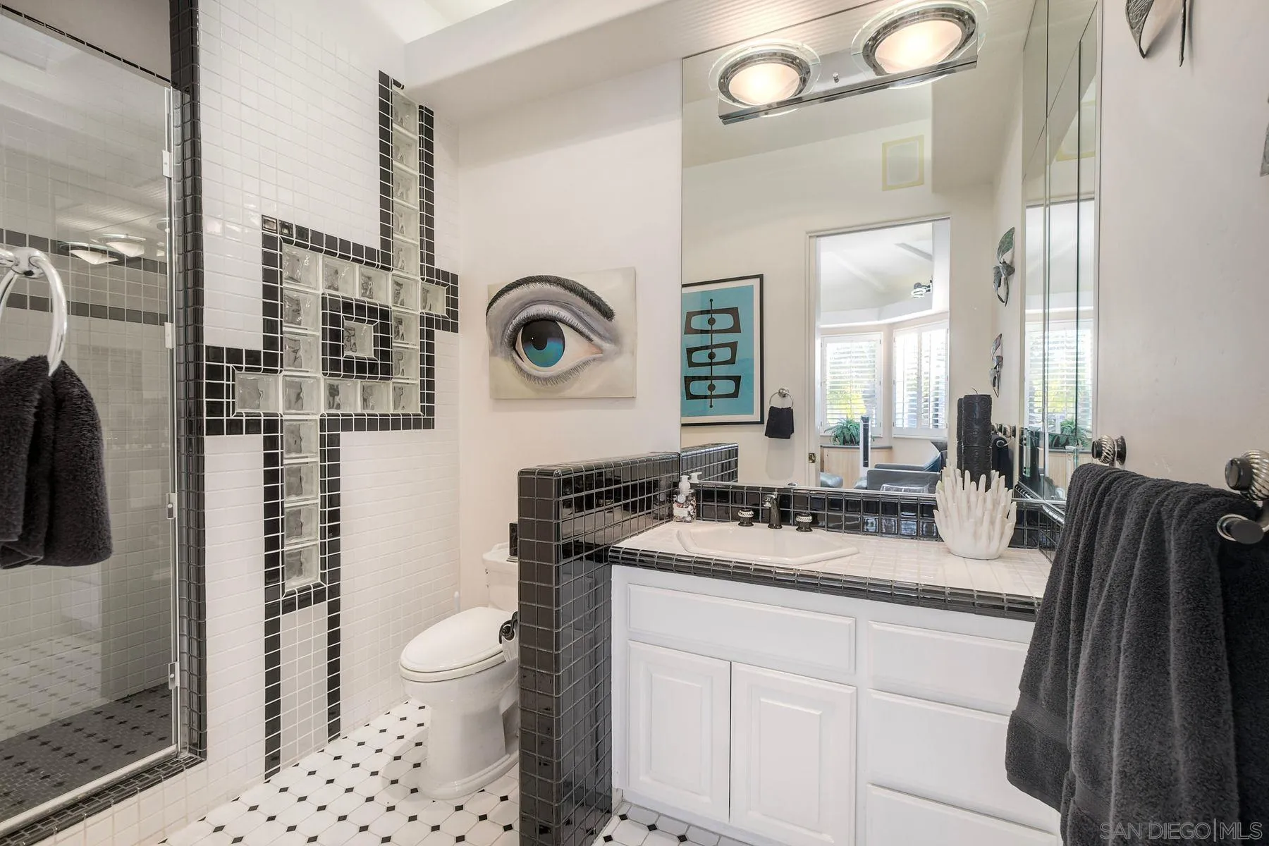 13455 Old Winery Road Poway, CA 92064 - Photo 23 of 46 a bathroom with a sink a toilet and a mirror