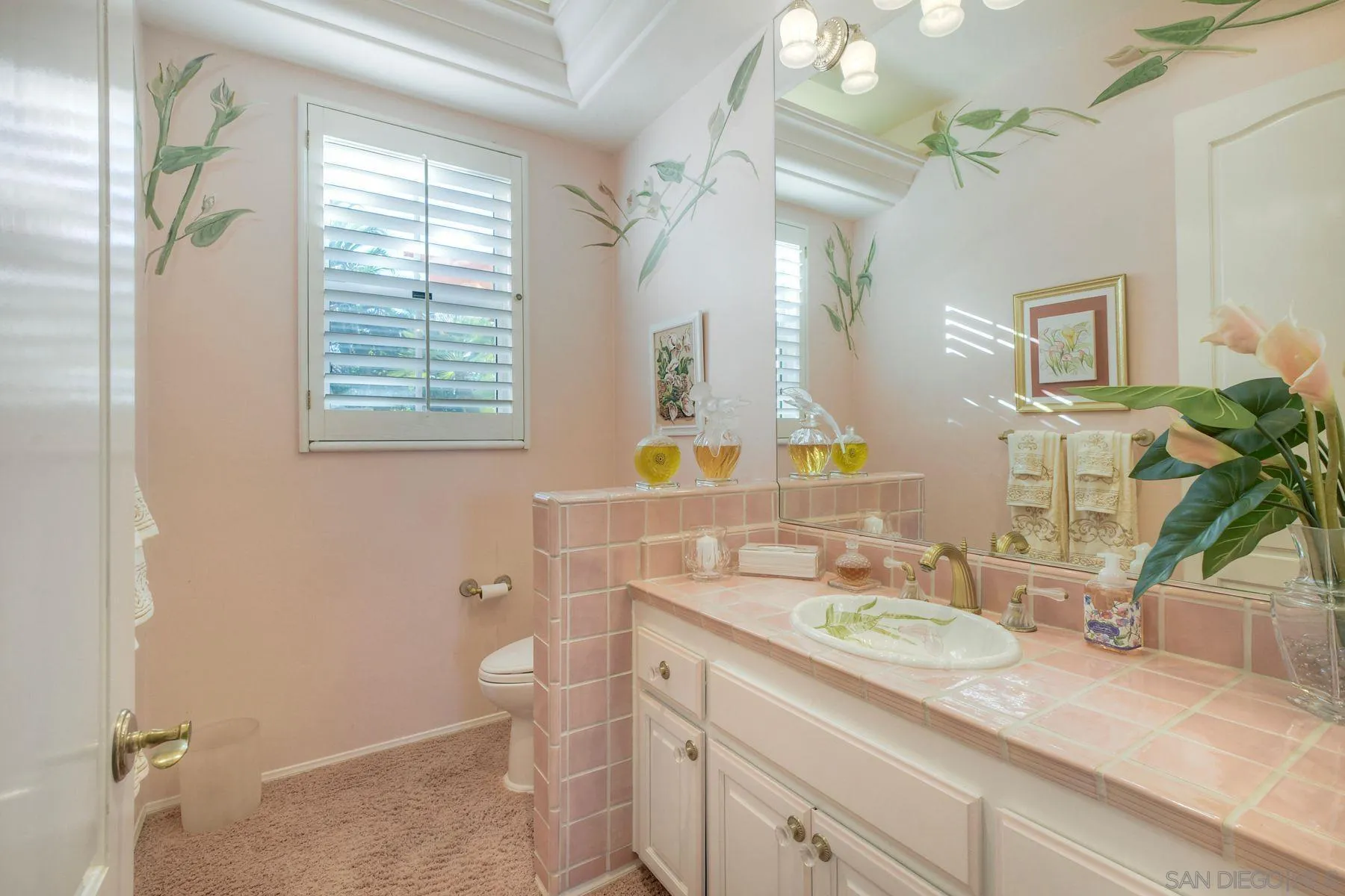 13455 Old Winery Road Poway, CA 92064 - Photo 24 of 46 a bathroom with a granite countertop sink mirror vanity and a toilet
