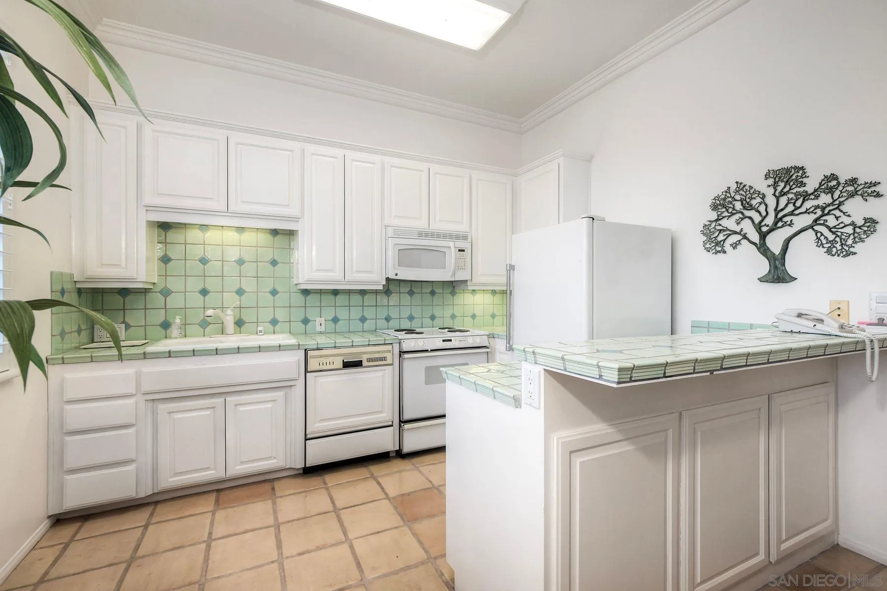 13455 Old Winery Road Poway, CA 92064 - Photo 31 of 46 a kitchen with cabinets appliances and a sink