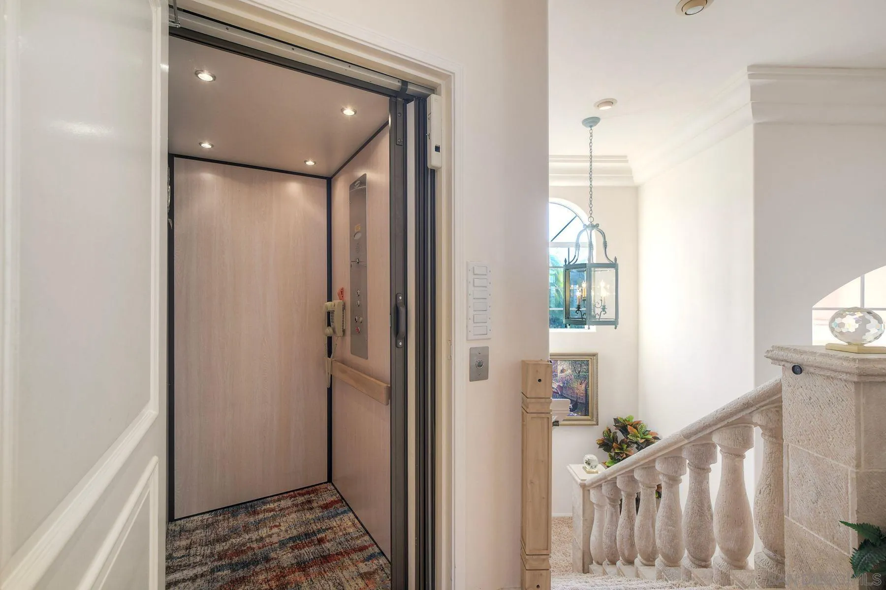 13455 Old Winery Road Poway, CA 92064 - Photo 36 of 46 a view of a hallway with wooden floor and stairs