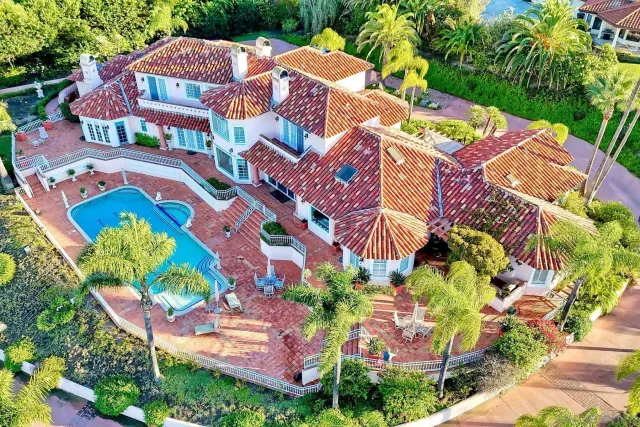 an aerial view of a swimming pool patio and outdoor seating
