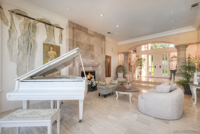 a very nice looking living room with a large window and furniture