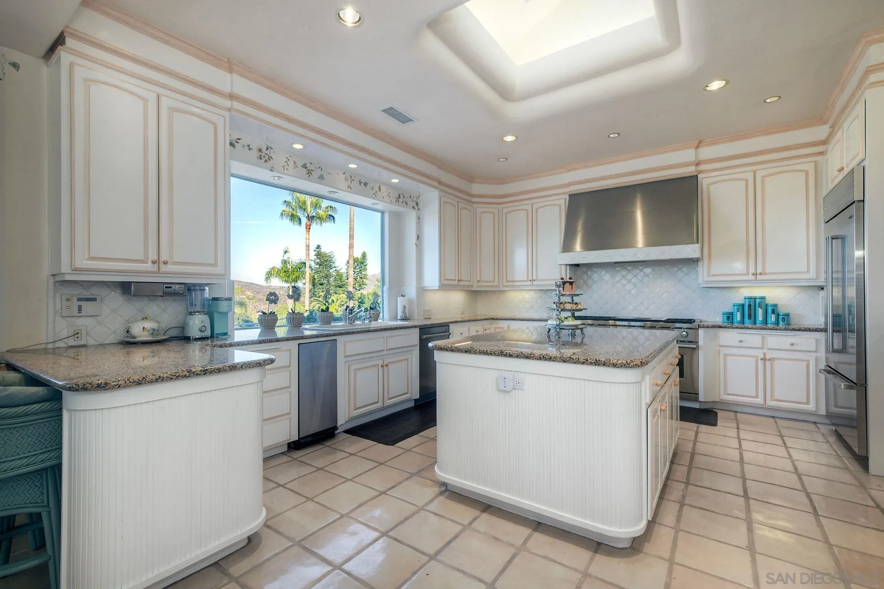 13455 Old Winery Road Poway, CA 92064 - Photo 8 of 46 a kitchen with stainless steel appliances granite countertop a sink and cabinets