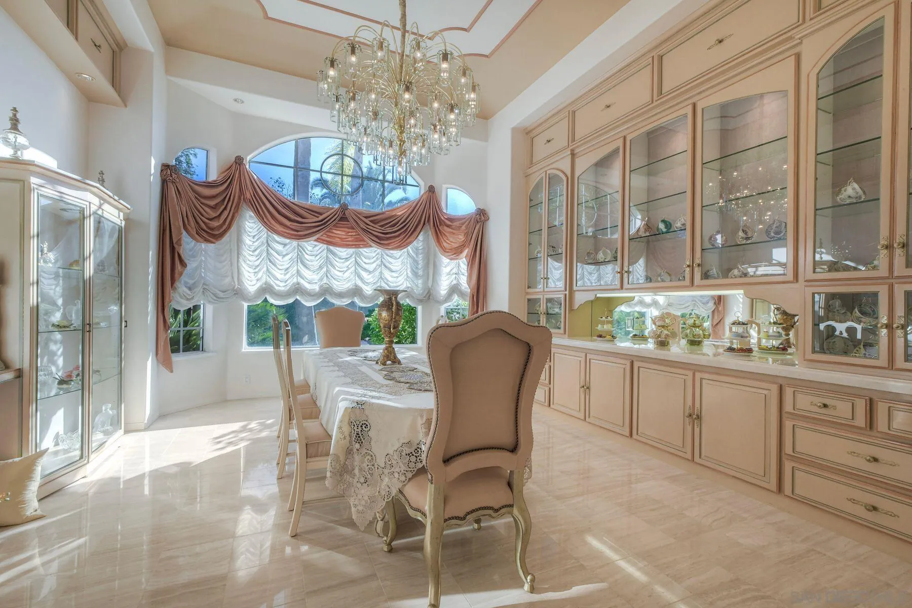 13455 Old Winery Road Poway, CA 92064 - Photo 10 of 46 a view of a dining room with furniture a chandelier and window