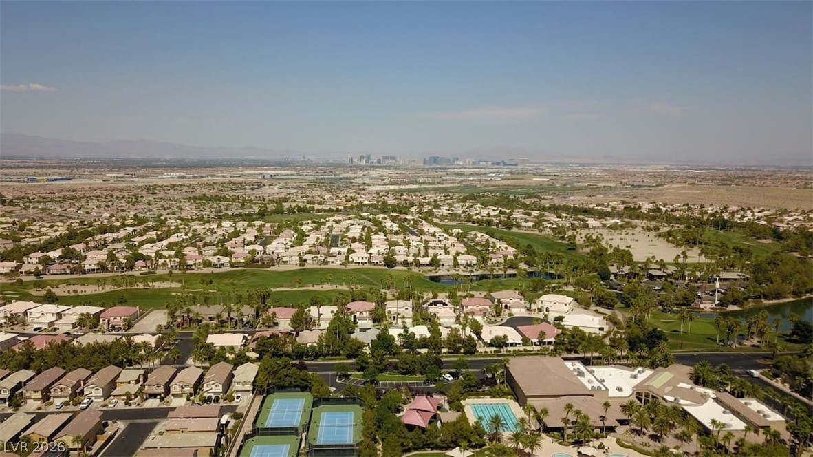 489 Foster Springs Road Las Vegas, NV 89148 - Photo 30 of 30 An aerial panorama reveals a vast residential community interspersed with lush golf greens and recreational amenities.