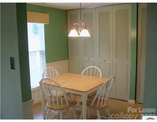 a kitchen with stainless steel appliances granite countertop a refrigerator a stove and a sink