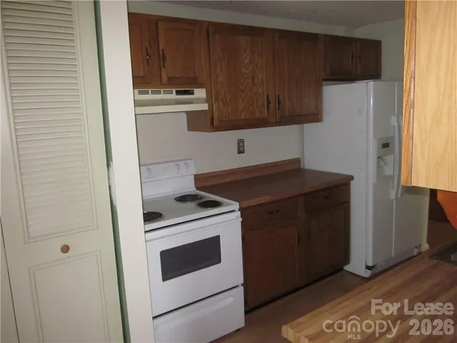 a kitchen with sink and window