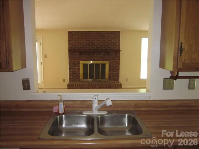 a white toilet sitting next to a bathroom sink and vanity
