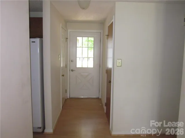 a view of hallway with windows