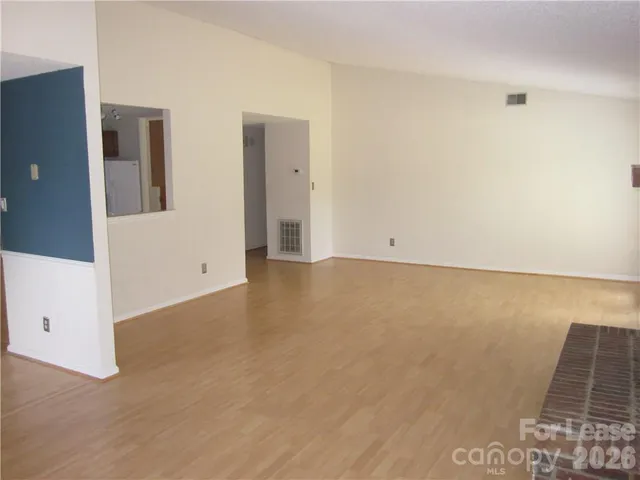 a living room with furniture and flowers