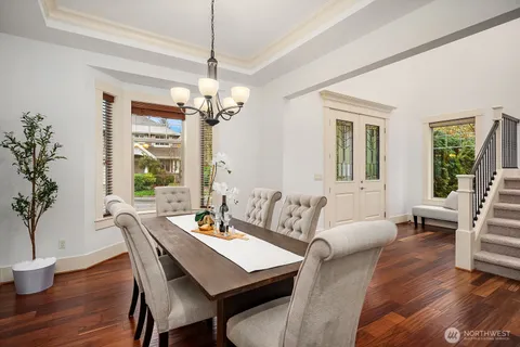 a living room with furniture a window and a chandelier