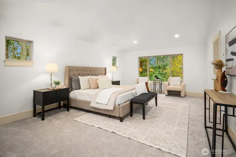 a bedroom with a bed and a couch