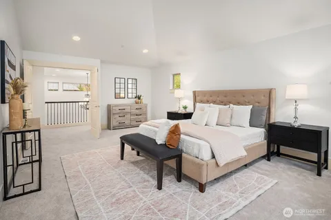 a bedroom with a bed and a couch