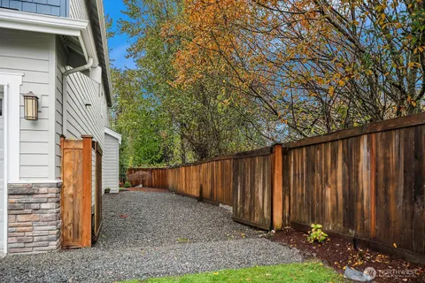 a view of a backyard with pathway