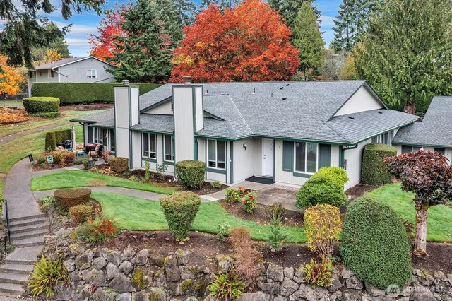 a front view of a house with garden