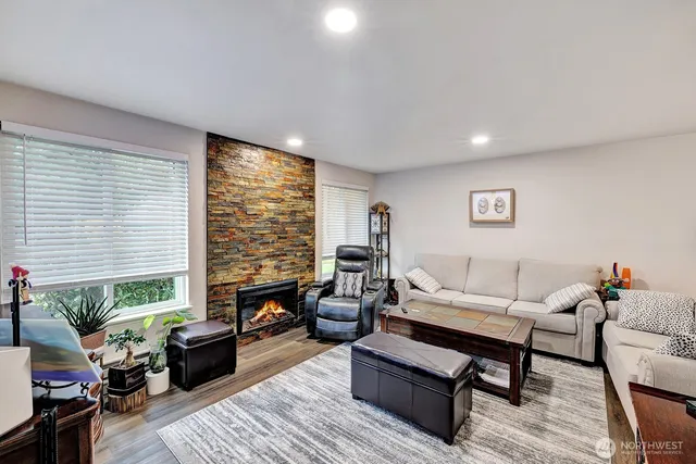 a living room with furniture and a large window