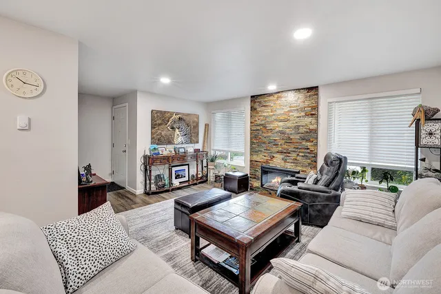 a living room with furniture and a large window
