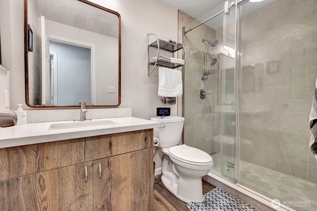 a bathroom with a sink toilet and shower