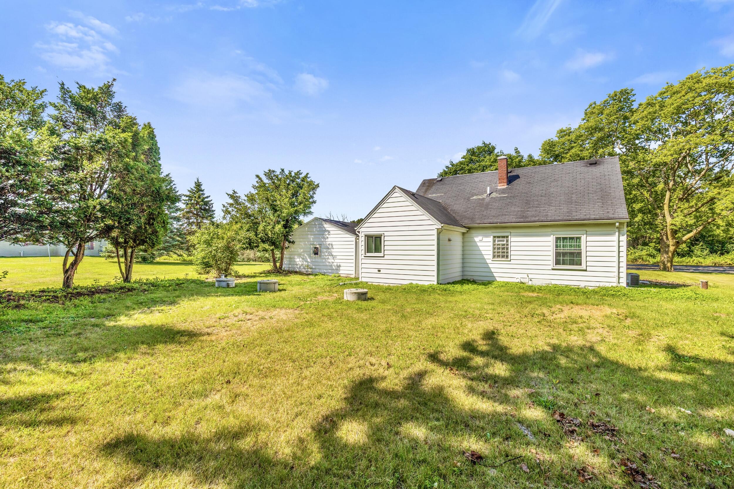 550 North Riverside Drive Saukville, WI 53080 - Photo 28 of 35 Wide open back yard for fun and games