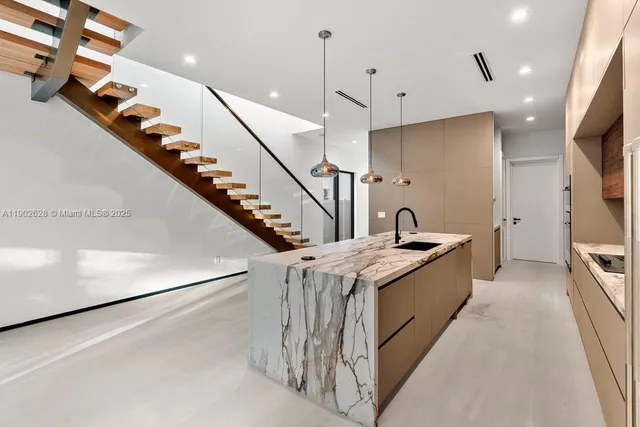 a very nice looking dining room with a large window