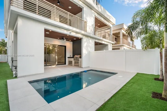 a bathroom with a double vanity sink mirror and shower