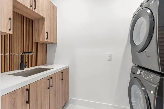 a kitchen with stove and cabinets