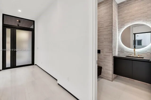 a bathroom with a sink and a mirror